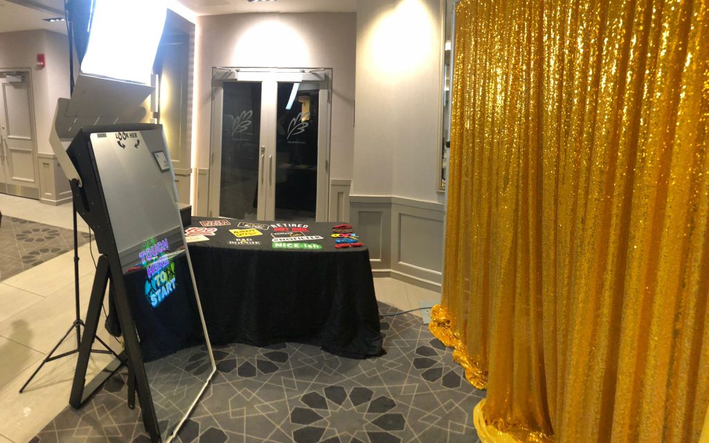 Mirror photo booth in Port Perry with props and a photo booth backdrop.