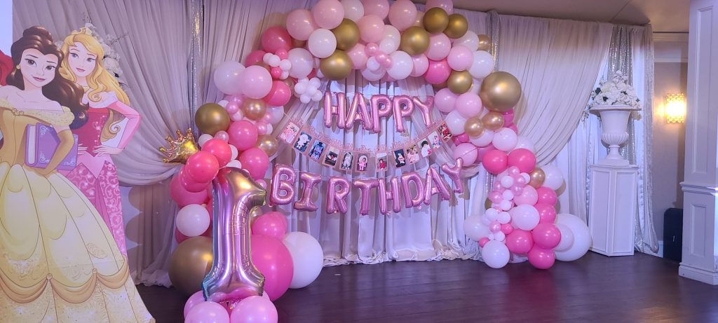 Mississauga kids birthday party decor. Balloon arch with happy birthday balloons and princess cutouts